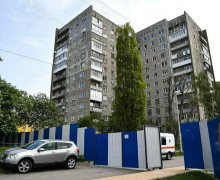 Громкоговоритель и вода в баклажках: как живёт непокорная высотка на Московском, 68